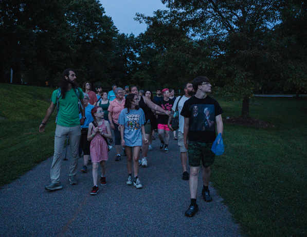a group of people walking on a path