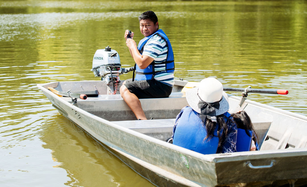 a man in a boat on water