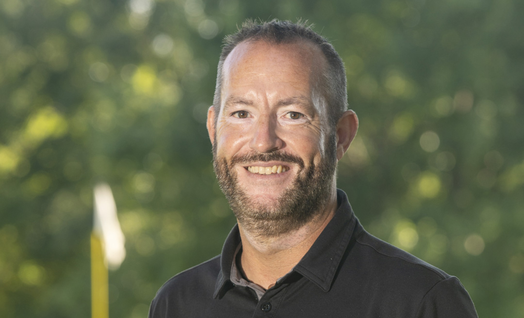 a man smiling for a picture