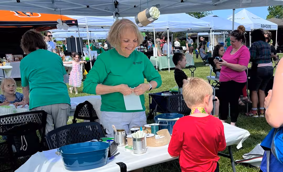 a group of people at a table with food items
