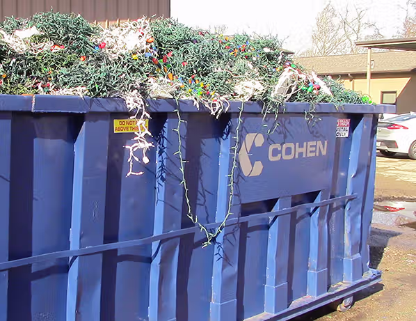 Container overflowing with holiday lights to be recycled