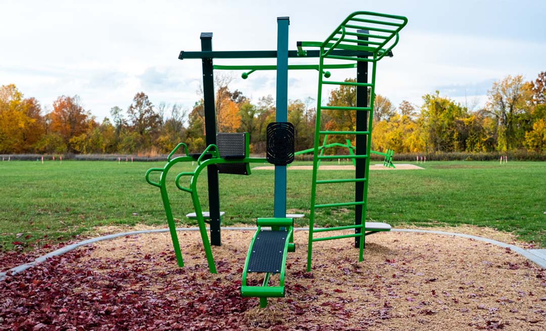 a playground with green and green equipment