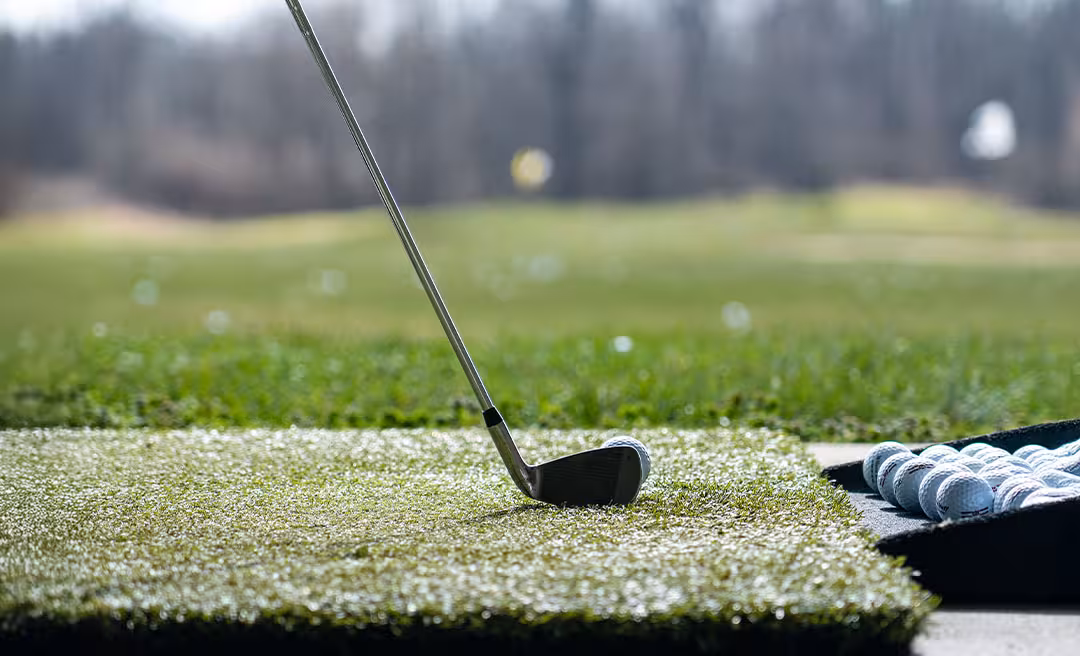 a golf club on a green field