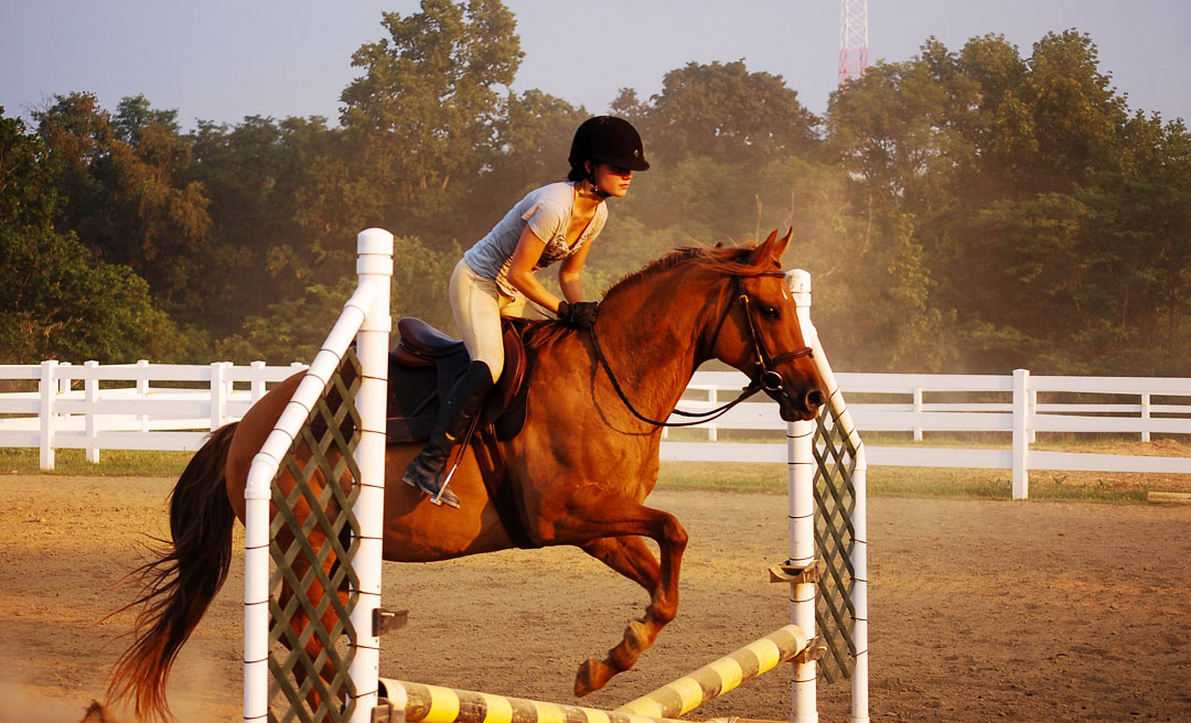 a woman riding a horse