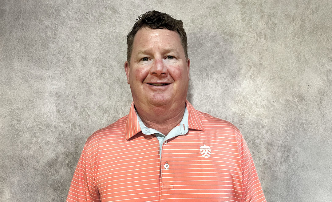 a man in an orange striped shirt