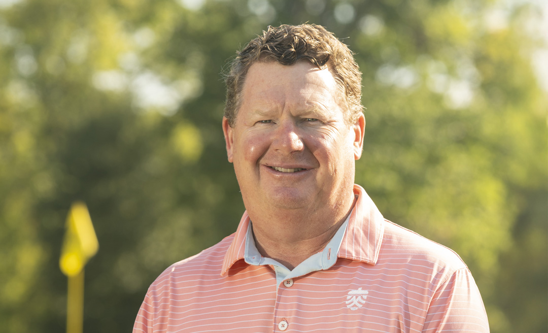 a man in an orange striped shirt