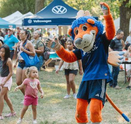 a person in a garment dancing in a field
