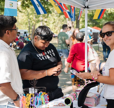 a group of people at a booth